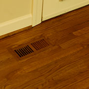 Completed oak flush mounted floor vent finished to match original floor